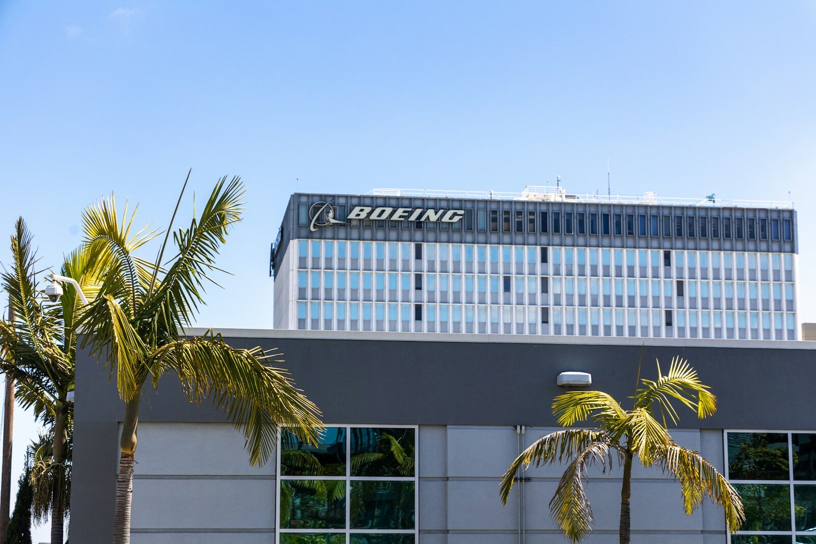 a building with palm trees in front of it