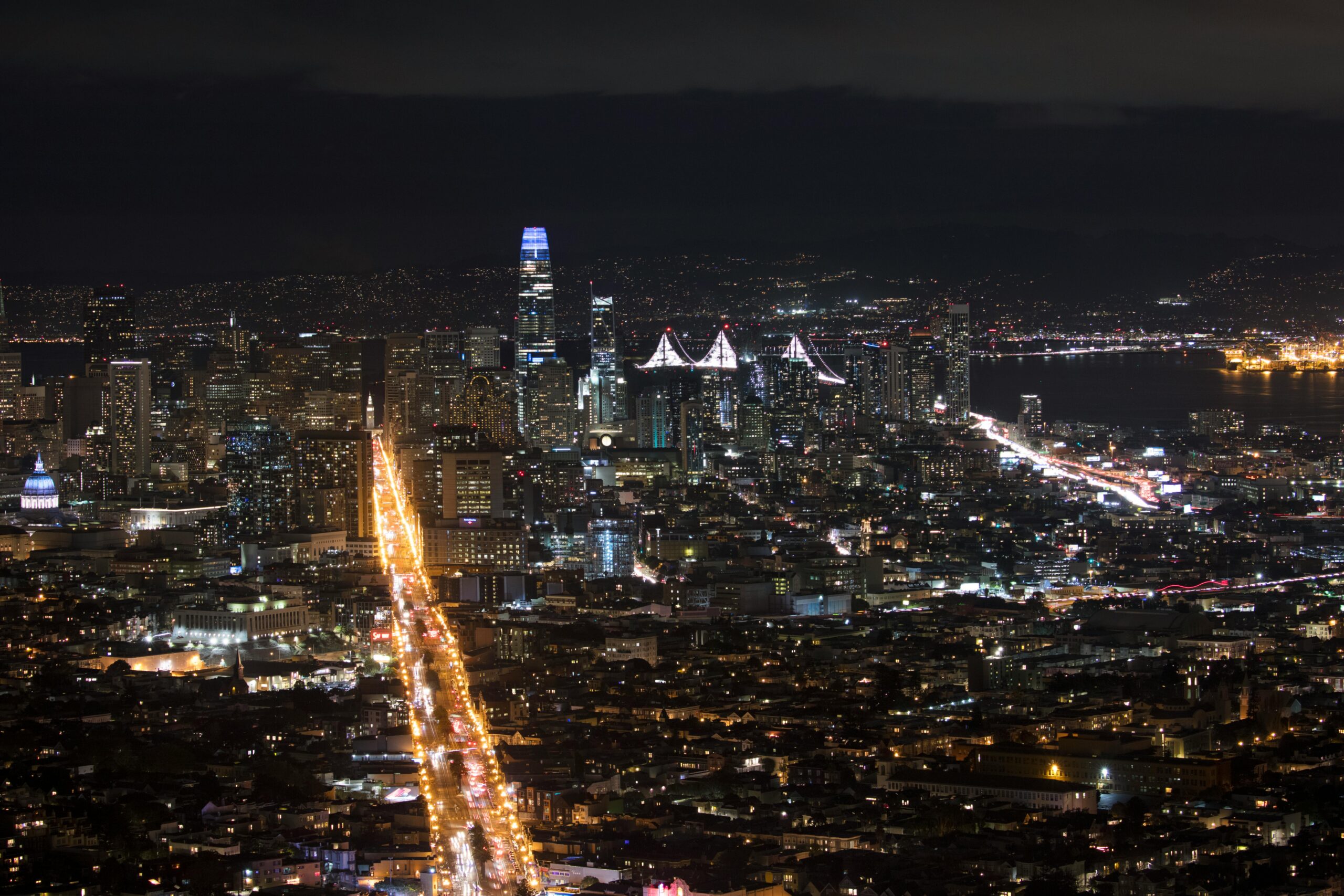 Breathtaking aerial view of San Francisco's illuminated skyline with iconic landmarks and city lights.