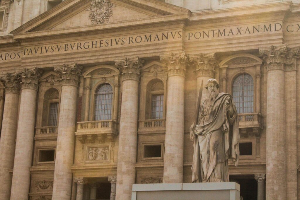 The Vatican Is New Warning About The Soul We Lose Along the Way. The majestic facade of St. Peter's Basilica in Vatican City featuring a prominent statue.