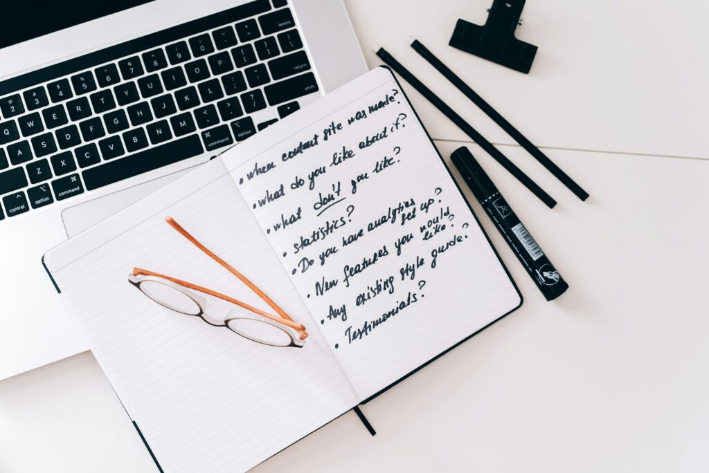 The Hidden Rules That Quietly Control New AI Behavior Organized workspace with laptop, notebook, and glasses, perfect for planning and strategy.