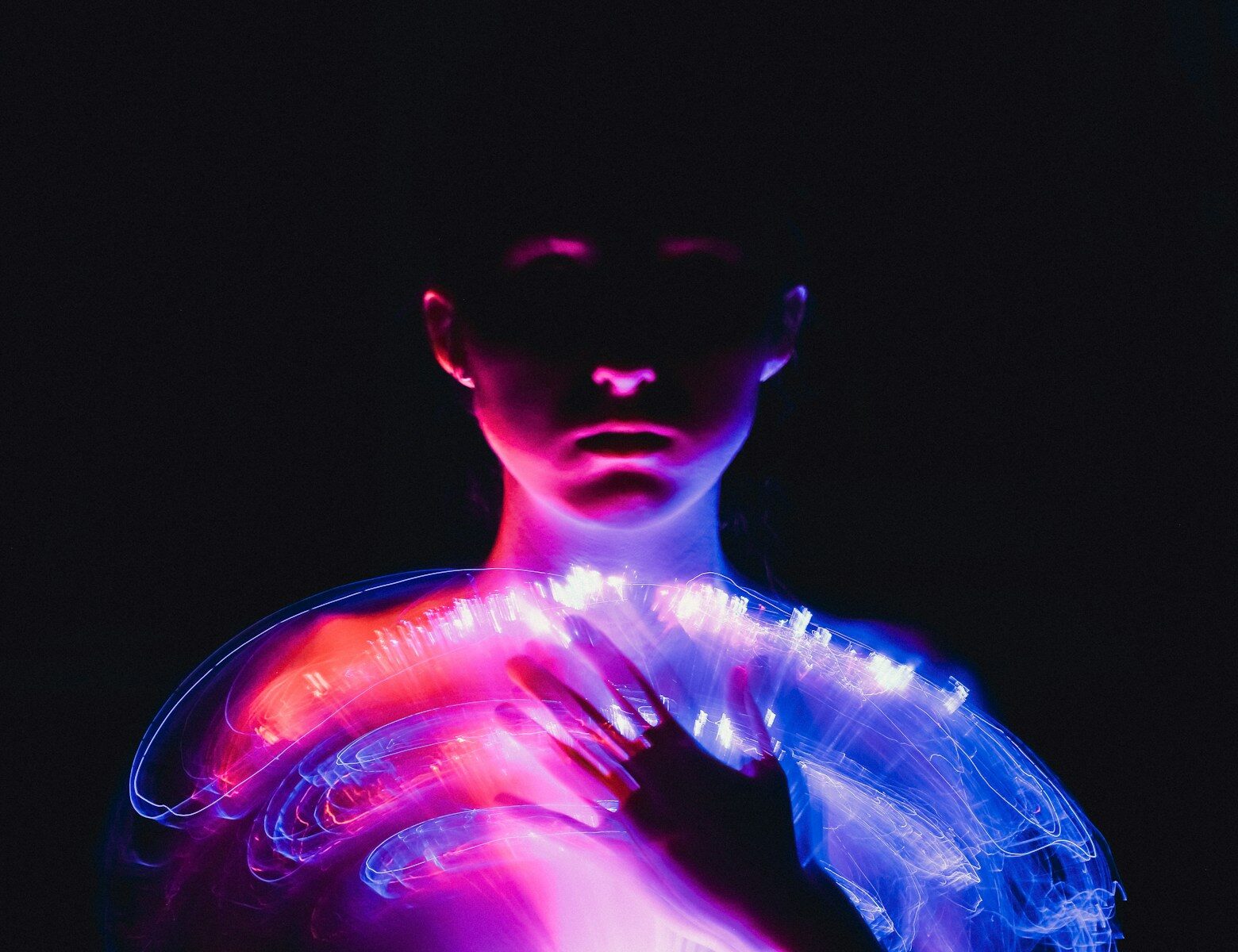 Silicon Valley’s New Religion Is AI-Powered Human Evolution And Faster A woman in a white dress with neon lights on her body