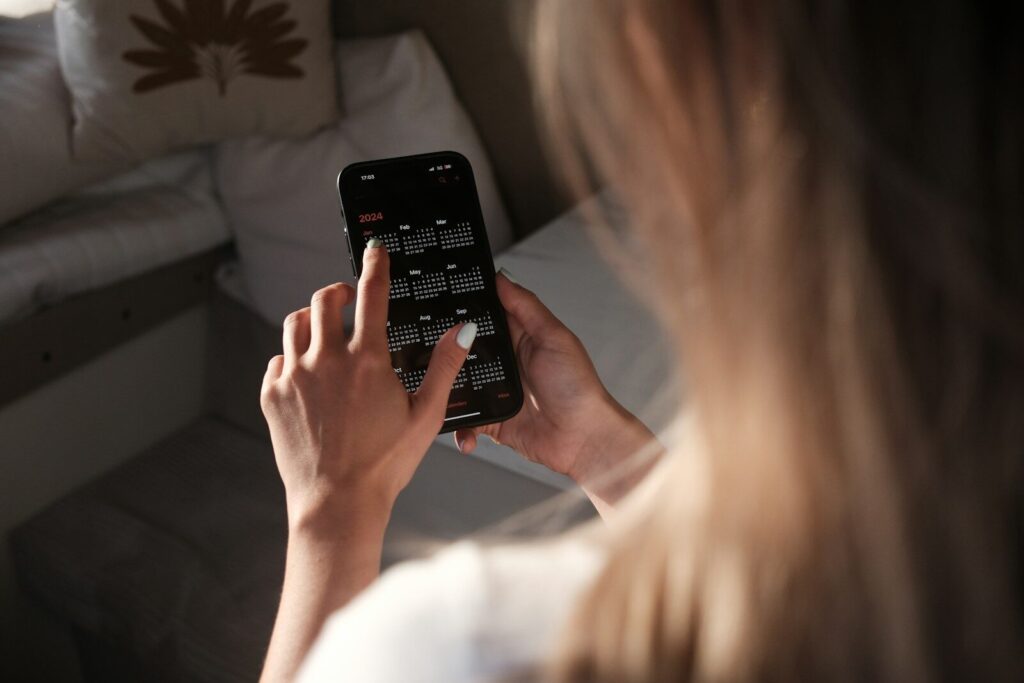 AI Is not “Taking” Your New Job — It’s Rewriting Job Itself a woman holding a cell phone up to her face