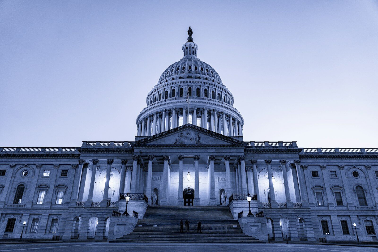 the capitol building is lit up at night