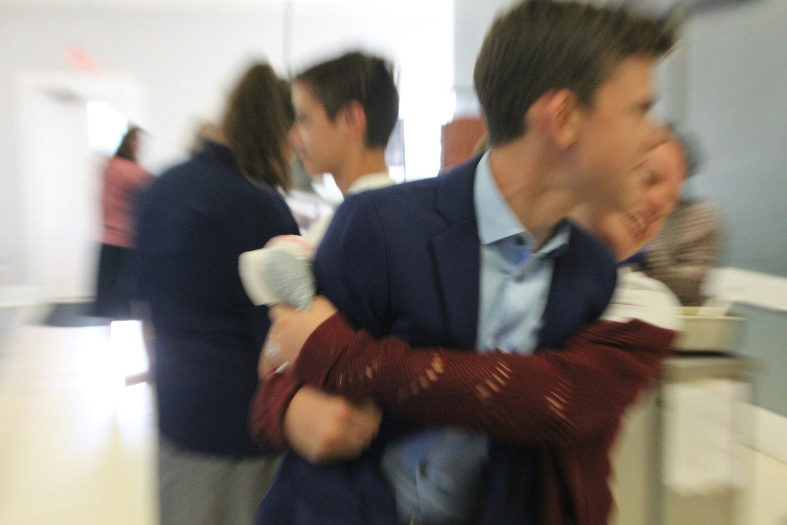 a man holding a baby in his arms