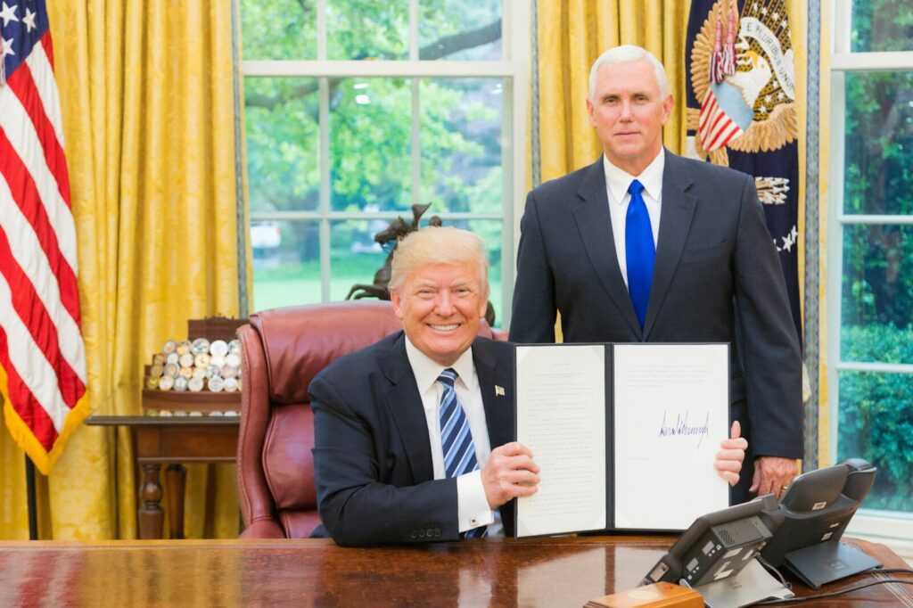 Why the Departure of Trump's New Top AI Adviser Matters 2 men in black suit sitting on red chair