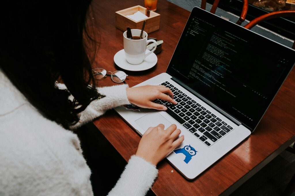 How AI Is Reshaping New Freelance Work Around the World a woman using a laptop computer on a wooden table