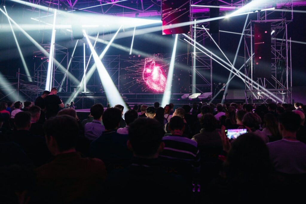 Why Global Perceptions of the New AI Race Are Shifting A crowd of people sitting in front of a stage