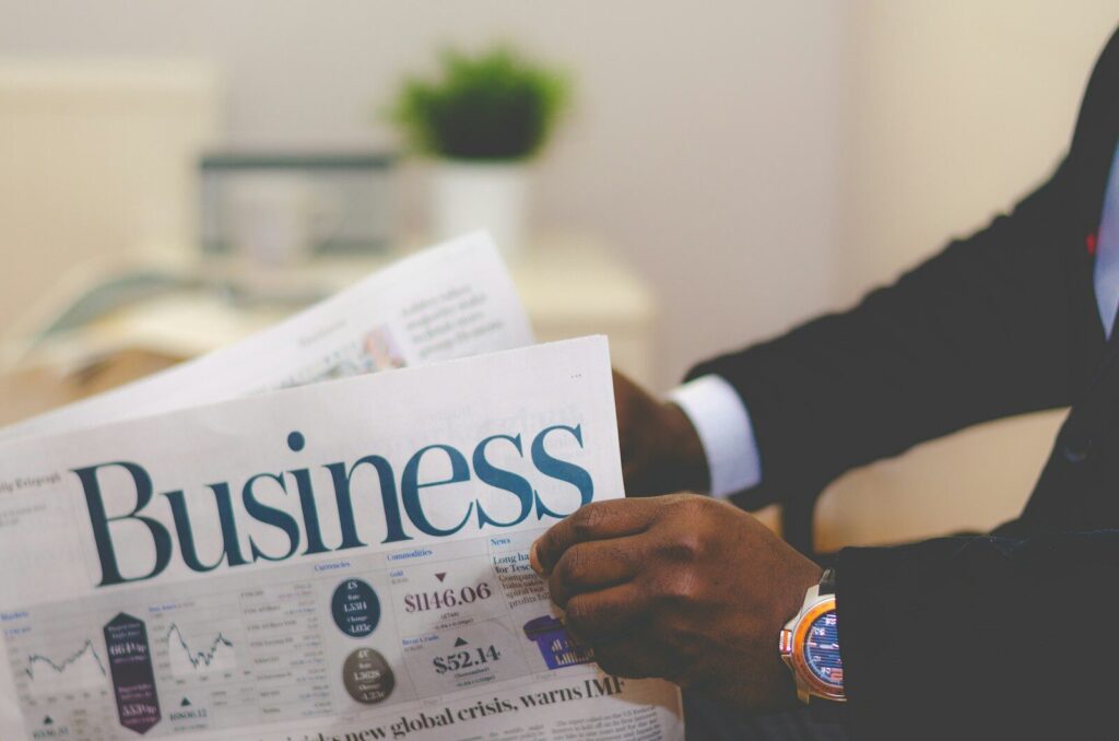 Inside Meta’s Vision for the New Autonomous Company person wearing suit reading business newspaper
