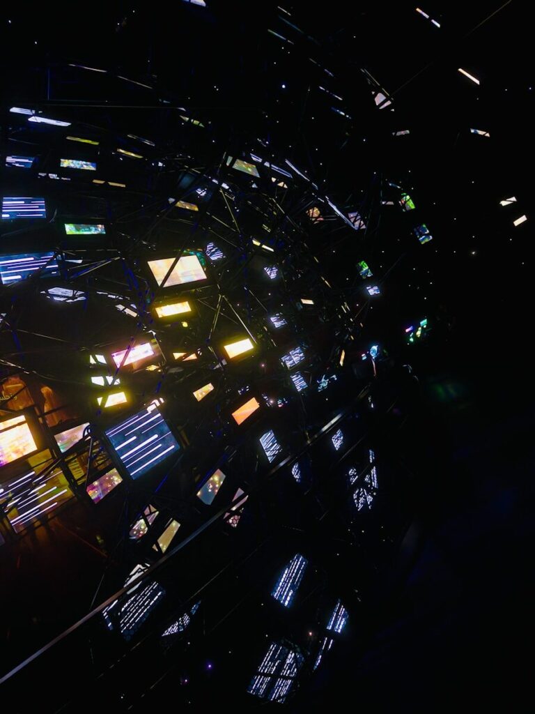 What the Next Decade of New AI Could Look Like Abstract network of glowing screens in darkness