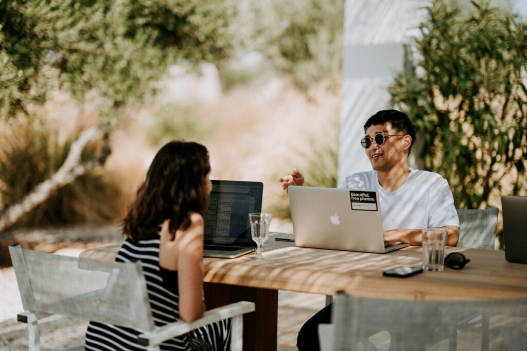 How AI Is Reshaping New Freelance Work Around the World man and woman sitting outdoors