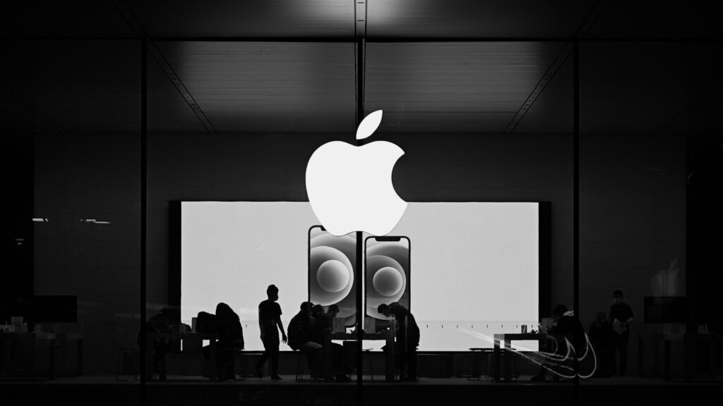 Inside the New Growing Clash Between Apple and EU Regulators people standing in front of white wall
