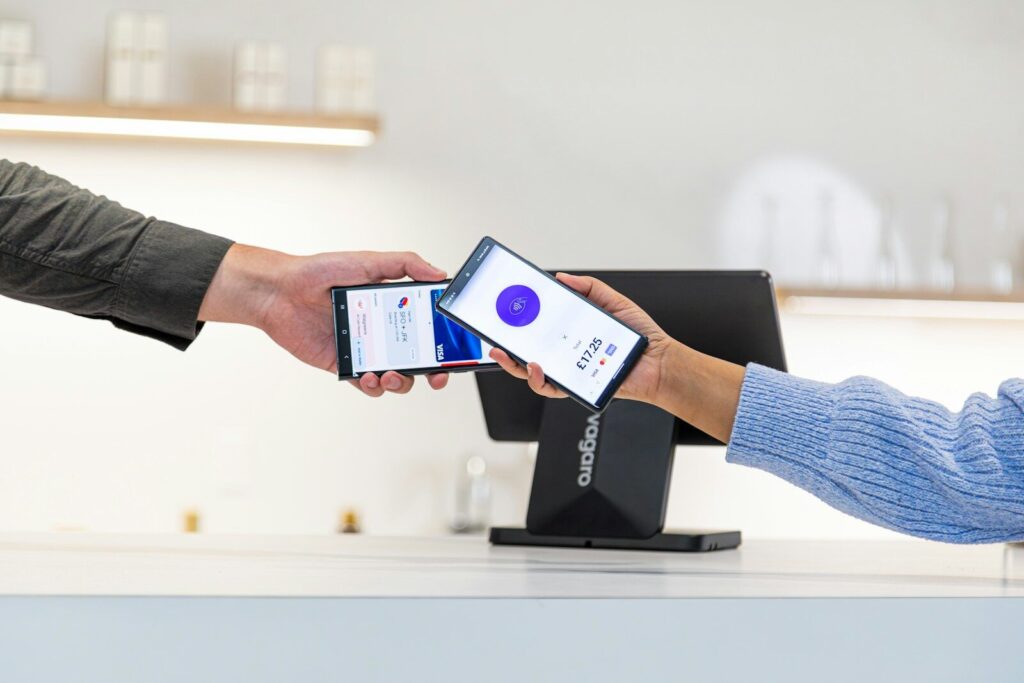 Why Future of New E-Commerce Belong to Machines, Not Consumers Customer paying with smartphone at point of sale terminal.