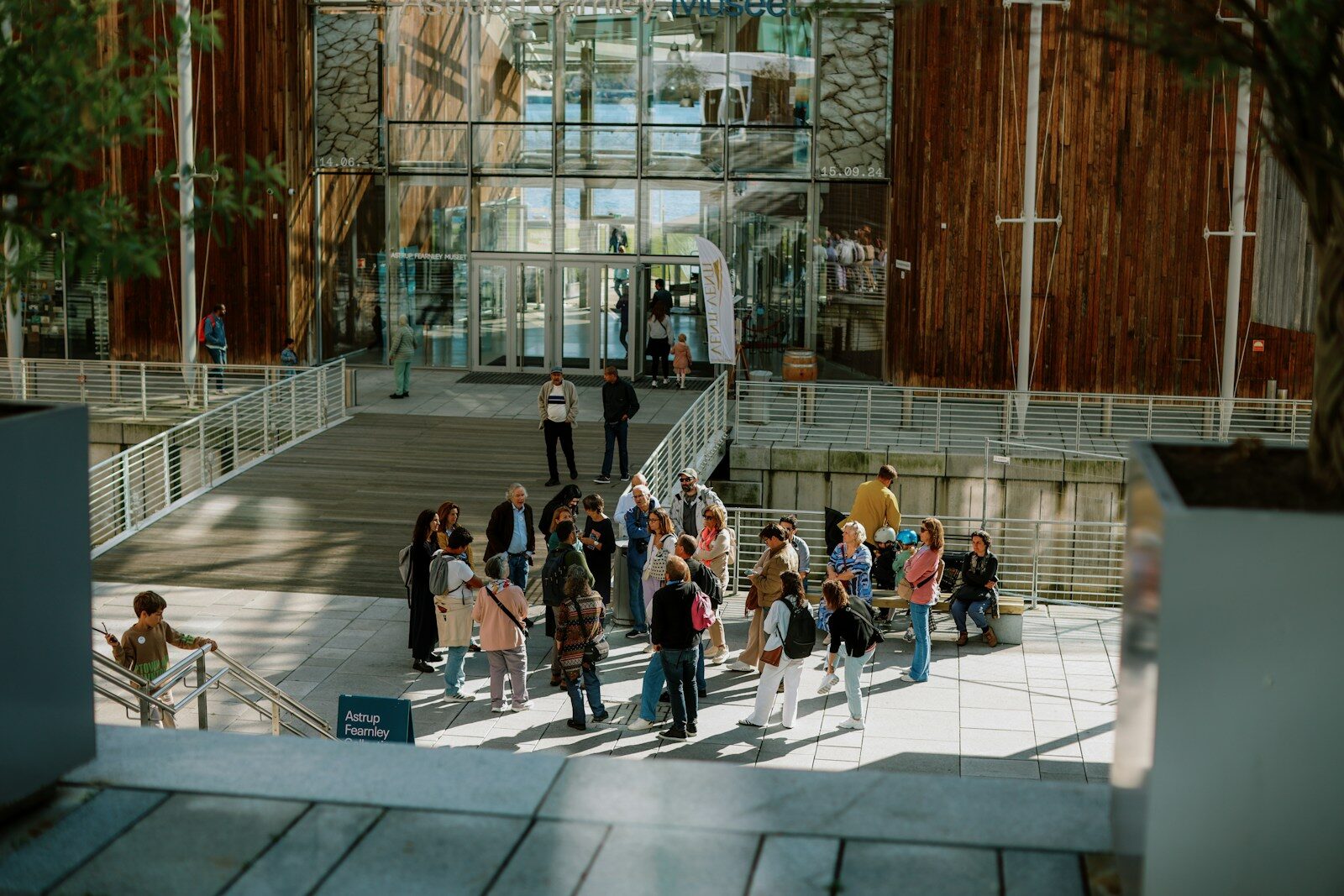 A group of people standing in front of a building
