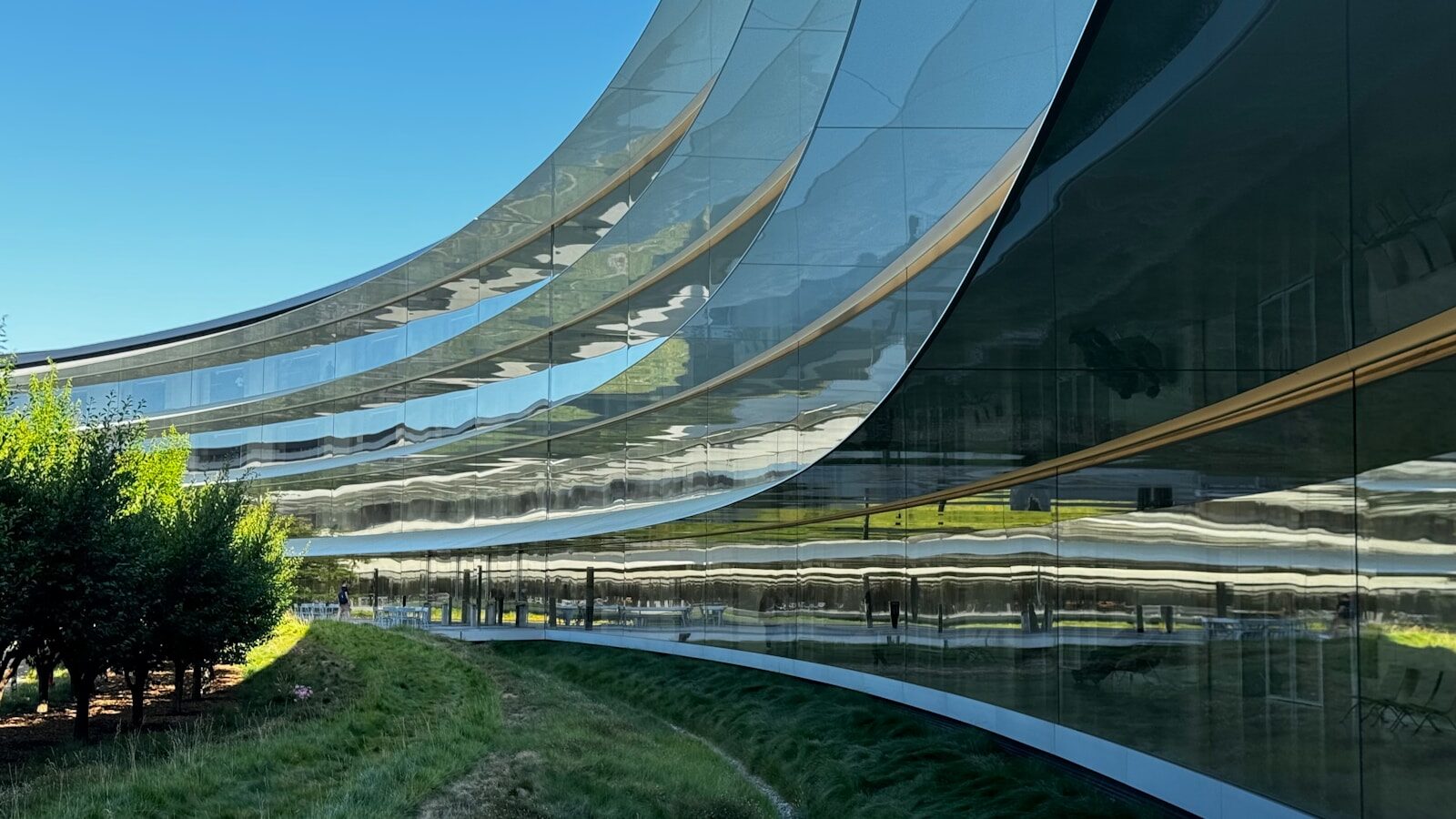 A curved building with a sky background