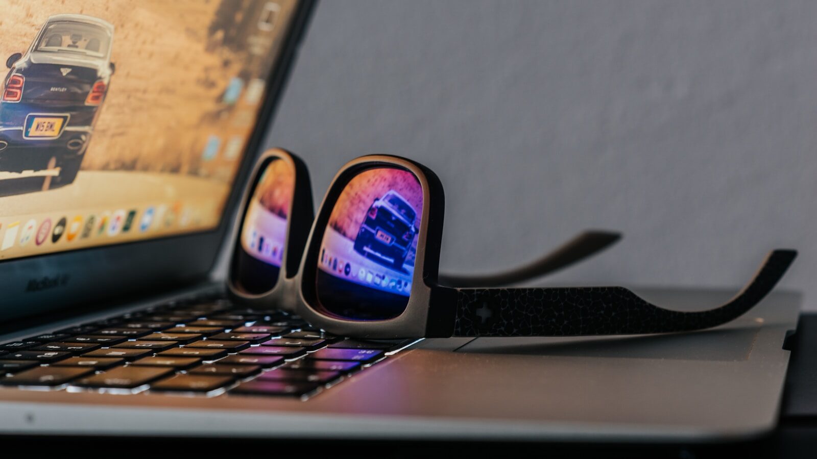 black smartphone on black laptop computer