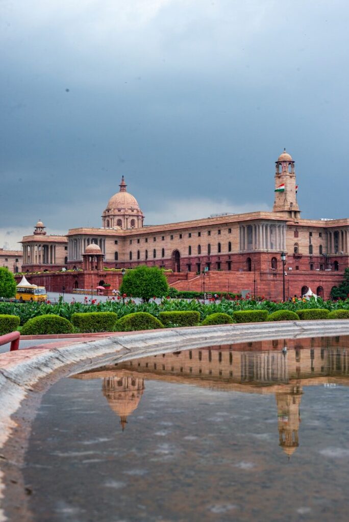 Grand building with dome reflected in water