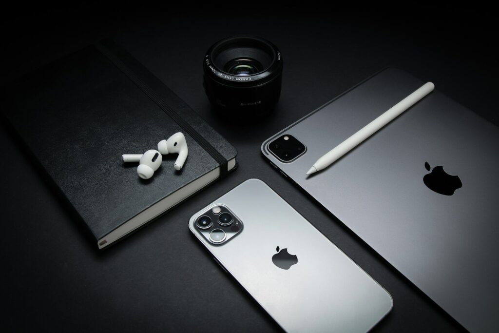 How a New Stunning Anniversary iPhone Could Redefine the Future silver macbook beside black camera lens and black camera lens