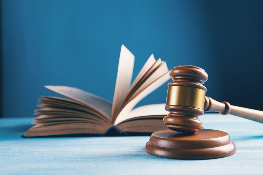 A Defining Moment for New AI Regulation in America judges gavel and open book on table