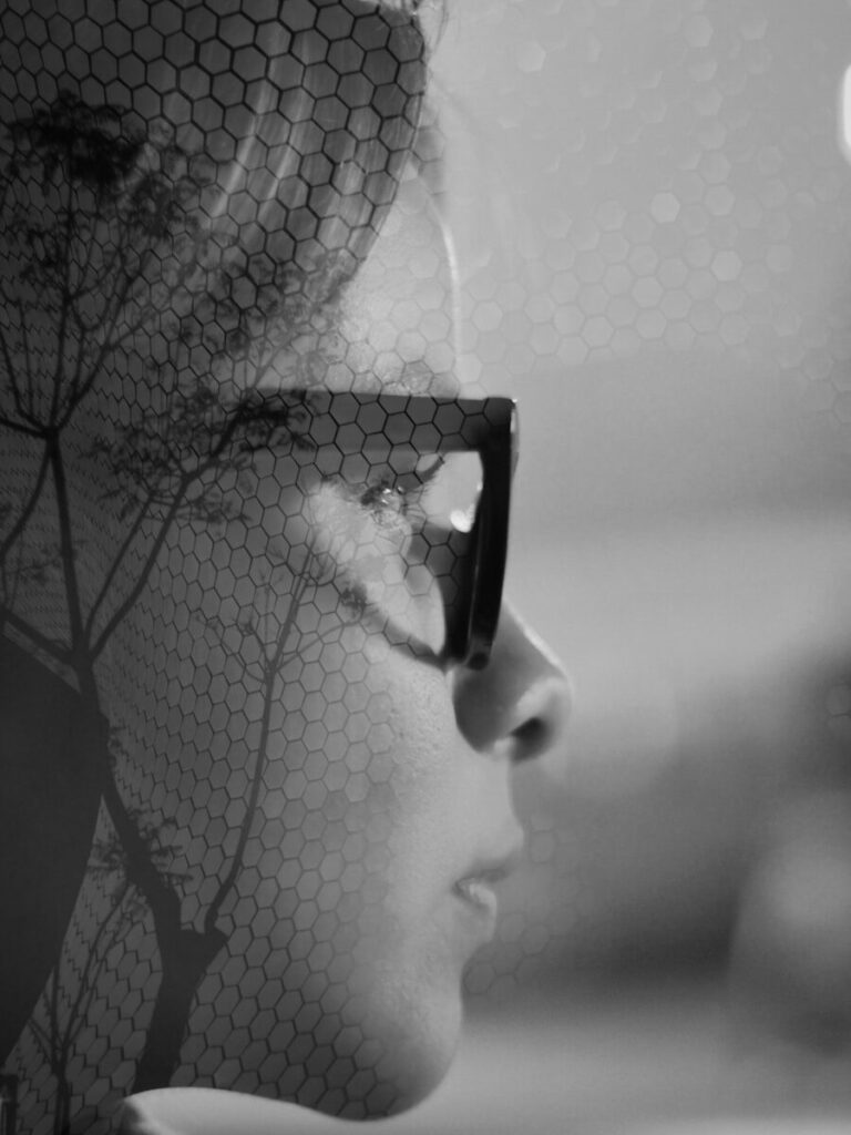 Why Battle Over AI Is Becoming New America's Political War Double exposure of a woman's face and tree branches.