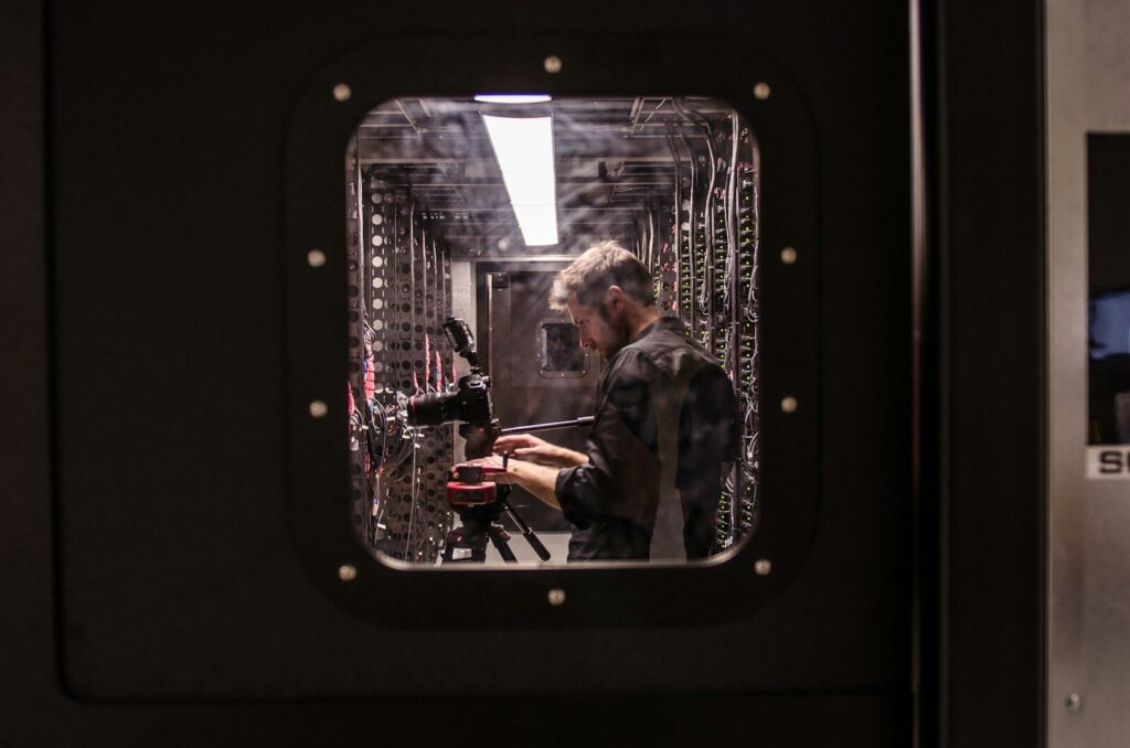 Eaton Moves Closer to Becoming New Pure AI Infrastructure Play man holding black DSLR camera