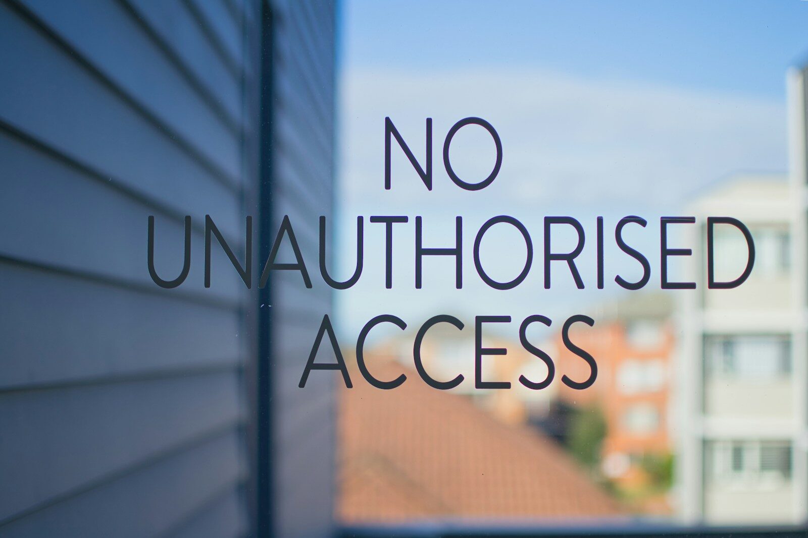 Why AI Companies Increasingly Restricting Their Most New Powerful Models No unauthorised access sign on glass door.