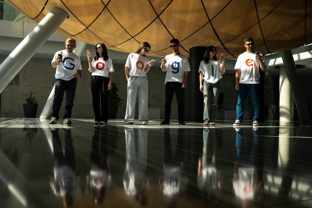 Why Global Perceptions of the New AI Race Are Shifting A group of people wearing t-shirts with letters