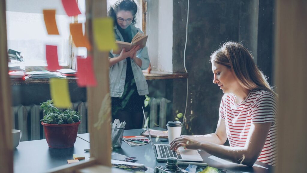 Why New Elite Students Are Choosing Entrepreneurship Over Traditional Internships Two people work together in a modern office.