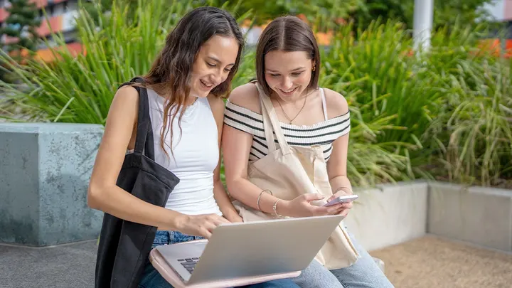 Preparing “Irreplaceable” Graduates in the New Age of AI college students laptop 1