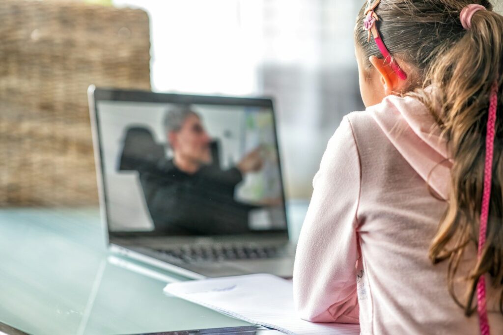 Why Wealthy Families Rethinking Traditional Schools in New Age AI woman in pink long sleeve shirt sitting in front of macbook pro