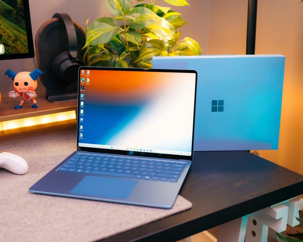 A laptop computer sitting on top of a desk