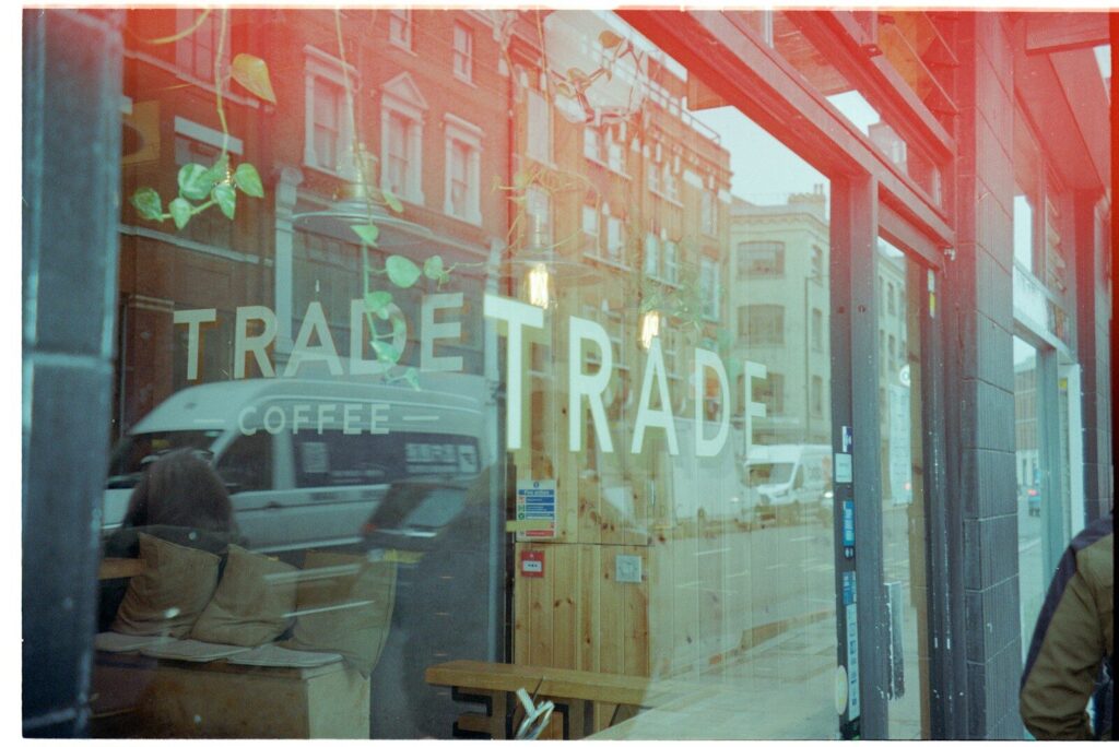 What Landmark Legal Battle Mean for New Future AI Hardware Reflection of a street scene in a coffee shop window.