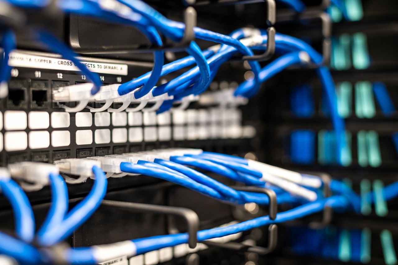 Why AI Data Centers Have Become New Flashpoint in America Blue plastic wires with white tips connected to server and provide access to information