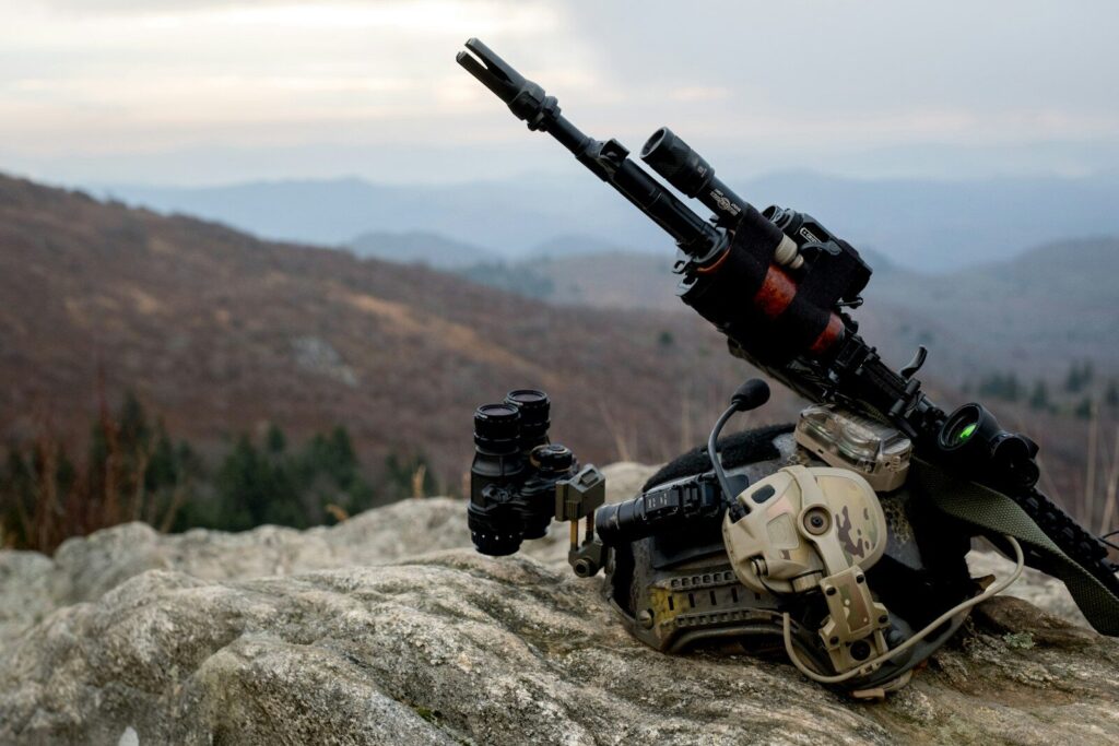 How Autonomous Military Systems Are Changing New Global Defense a machine gun laying on top of a rock