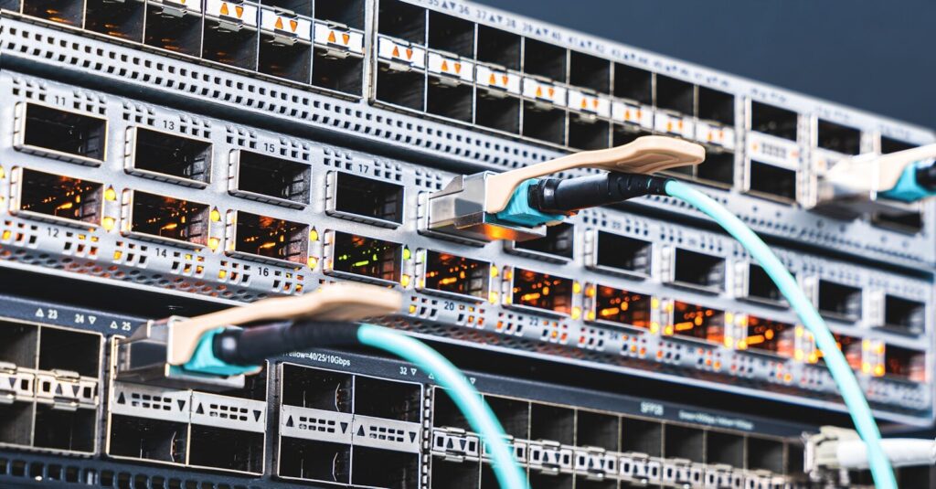 The Hidden Builders Behind the New AI Boom a bunch of wires that are connected to a server