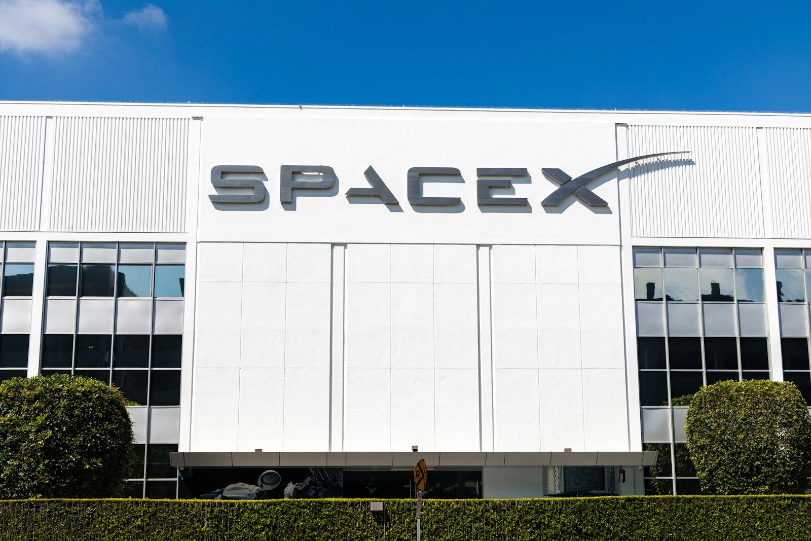 What SpaceX's Prototype Reveals About the New Future AI Hardware a building with a sign that says spacex on it
